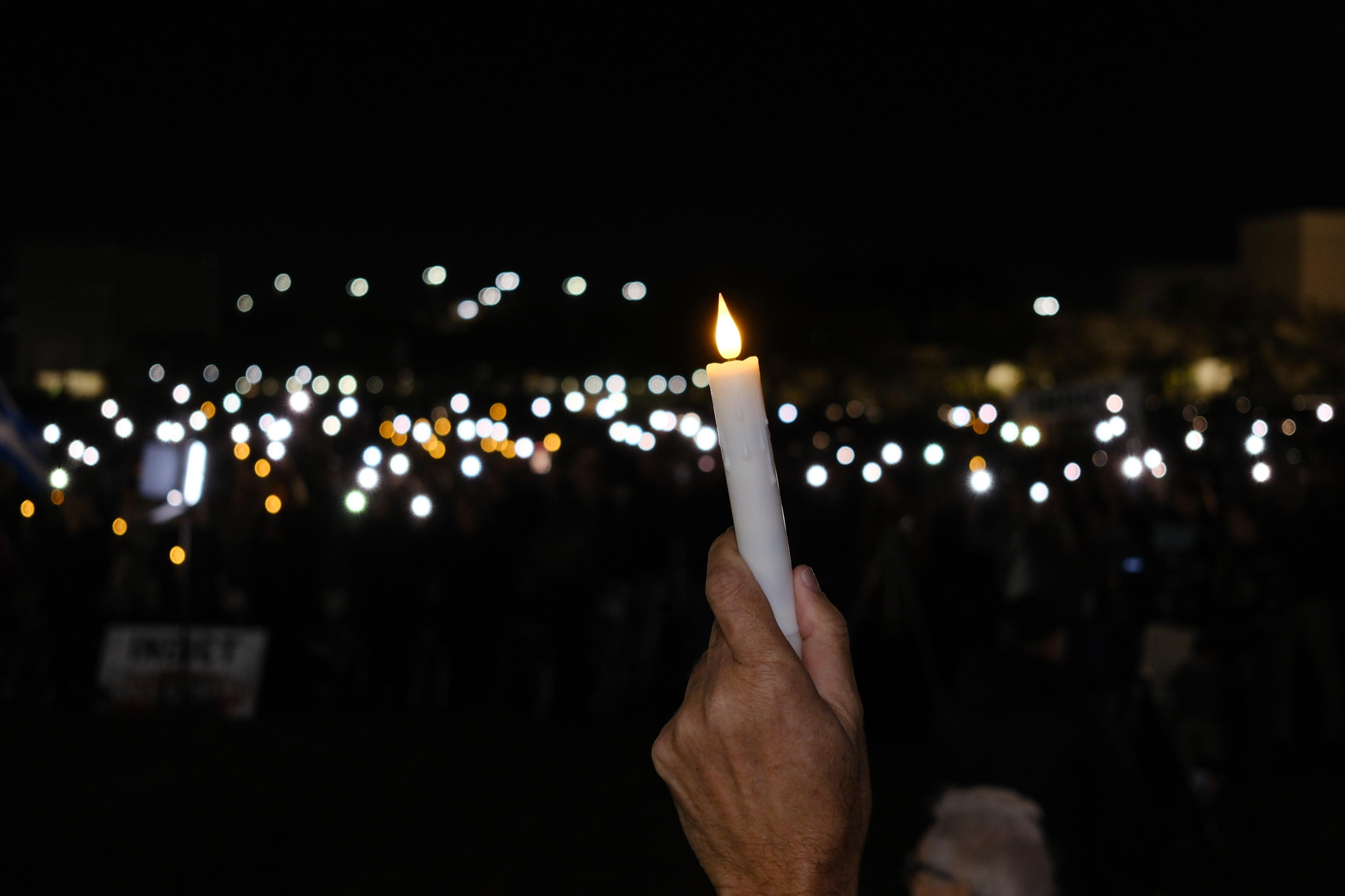 candle-with-lights-from-the-crowd.jpeg