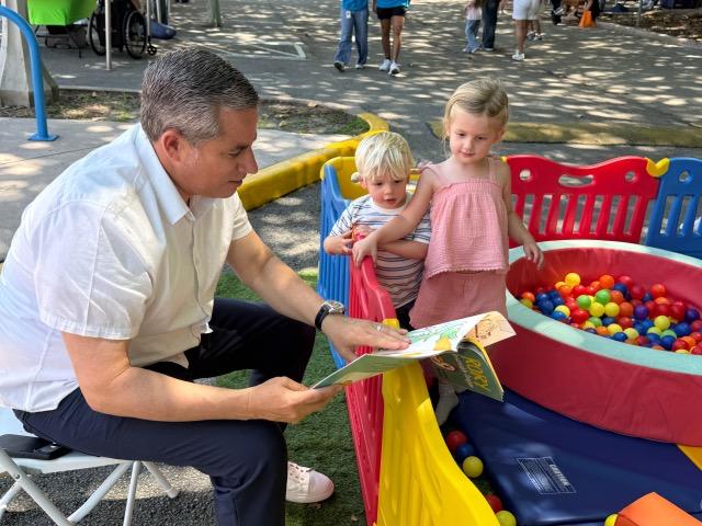 fernandez-reading-book-to-children-medium.jpeg