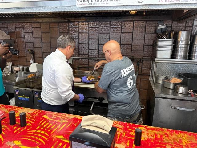 fernandez-serving-hot-dogs.jpeg