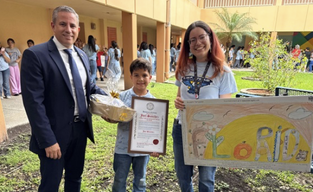 Tax Collector Dariel Fernandez Celebrates Student Joel Sanchez’s Winning Achievement in the 2026 Kids Tag Art Competition